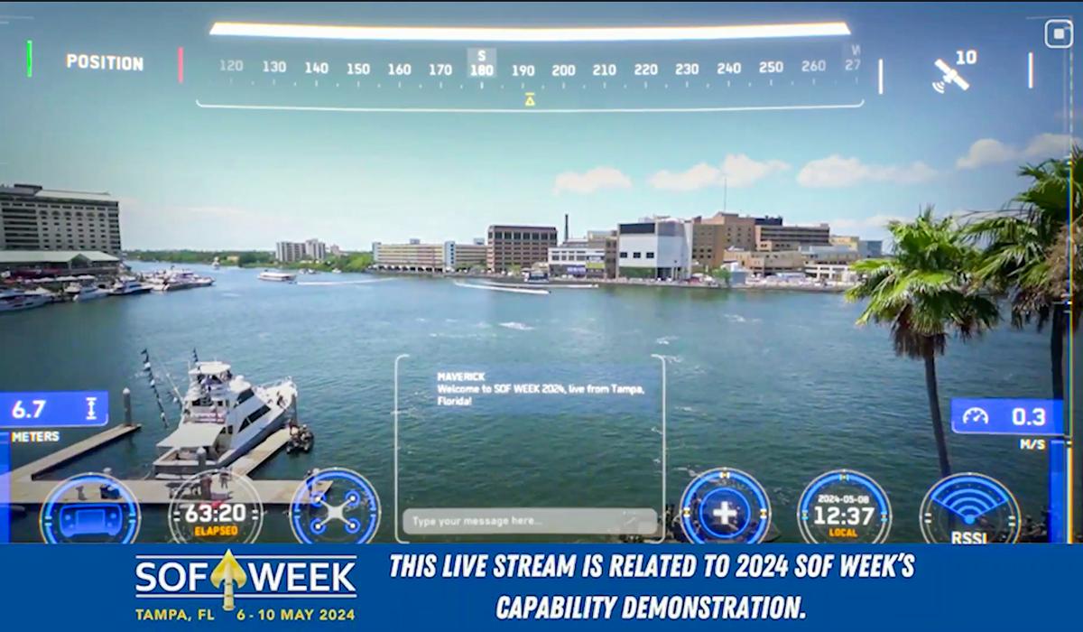 A live stream view over a waterfront in Tampa, Florida, shows boats, water, and city buildings under a blue sky. Overlay graphics display data and controls. A banner mentions SOF Week 2024 Capability Demonstration.