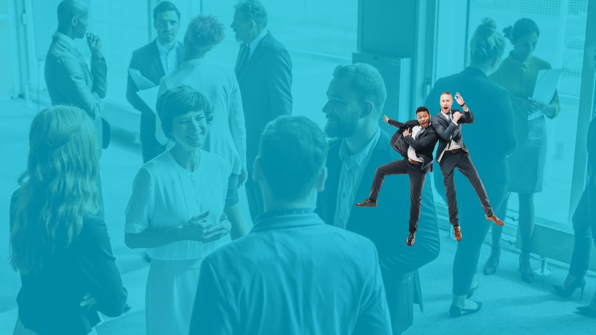 A group of people in business attire talk in a bright, modern office space. Two men in suits, standing out vividly, jump and pose enthusiastically in the foreground.